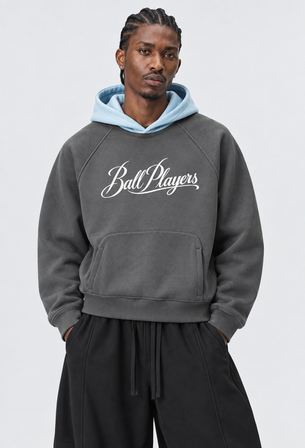 Catalog refresh 2026-09 | Primary front model view | Unisex Fleece Raglan Color Block Hoodie | Dark Gray with Light Blue